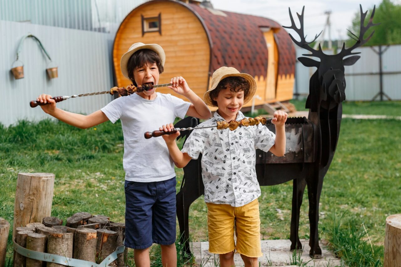 hungry boys eating bbq rib outside